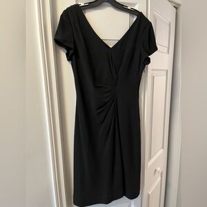 Black deep V neckline dress with gathering at waist.
